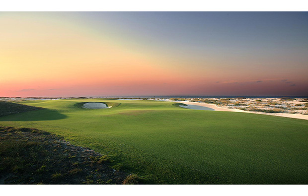sunset over saadiyat island beach golf club, abu dhabi, united arab emirates