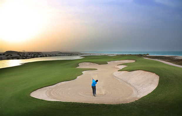 bunker play at saadiyat island beach golf club, abu dhabi, united arab emirates