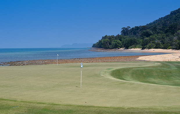 view over green to sea at the els club, langkawi
