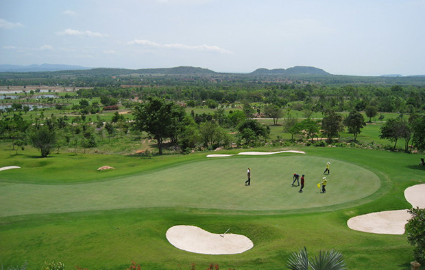 golfers putting, narai hills golf resort, khoa yai, thailand