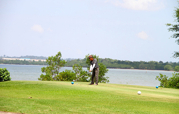 golfer at tering bay golf club in batam island indonesia 