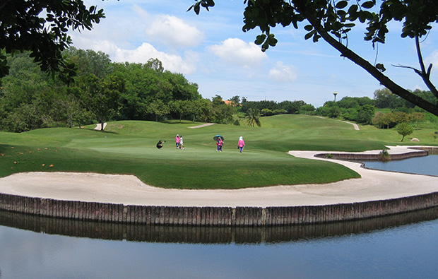 players on green, burapha golf club, pattaya, thailand