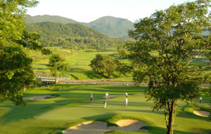 golfers at chiangmai highlands golf resort, chiang mai, thailand