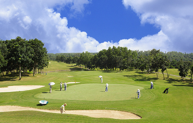 golfers and caddies, dong nai golf resort, ho chi minh, vietnam