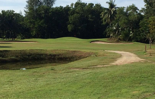 Green beside beach at Tublamu Navy Golf Course